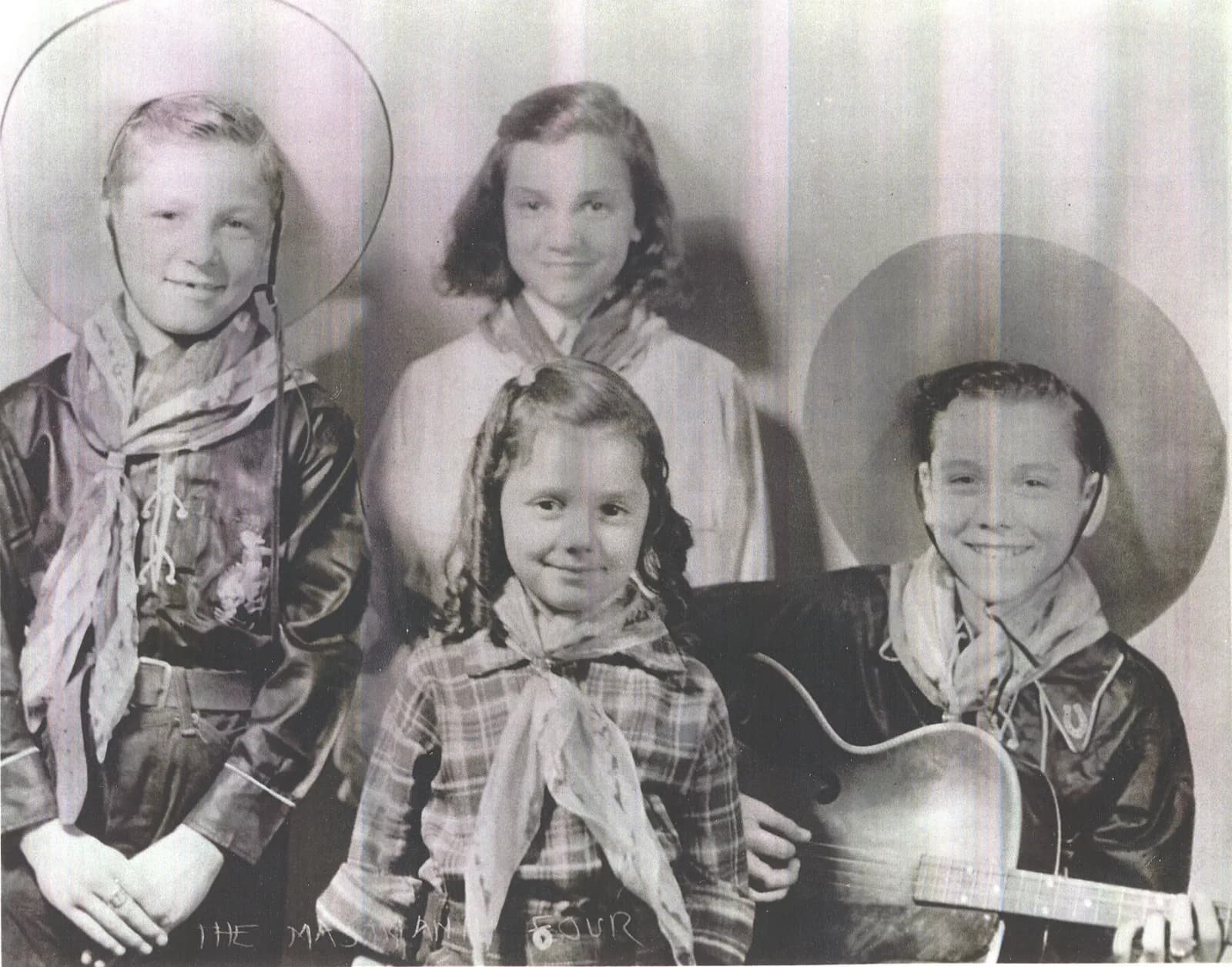 The Mastrianni Quartet — four young Plainville children dressed as cowboys with instruments